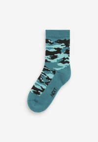 Türkise Socken mit einem schwarz-hellblauen Camouflage-Muster. Gerippter Bund und glatte Textur. Markenlogo "NEXT" an der Seite.