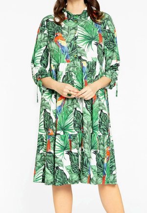 Blumenkleid mit grünen tropischen Blattmustern und bunten Papageien. Hergestellt aus leichtem Stoff, mit Knopfreißverschluss vorne und umgeschlagenen Ärmeln.