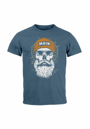 Blue cotton t-shirt featuring a skull graphic with a white beard, wearing an orange beanie labeled "MOIN," with accompanying text and compass design.