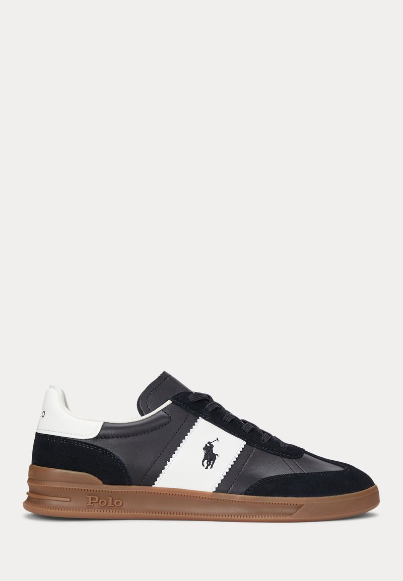 Navy and white leather sneakers with suede accents, round toe, flat rubber sole, and logo detail on the side. Lightweight design.