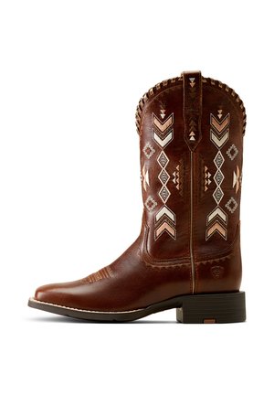 Brown leather cowboy boot with embroidered geometric patterns in cream and rust. Features a round toe and stacked heel, with decorative stitching.