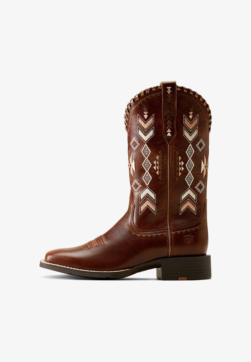 Brown leather cowboy boot with embroidered geometric patterns in cream and rust. Features a round toe and stacked heel, with decorative stitching.