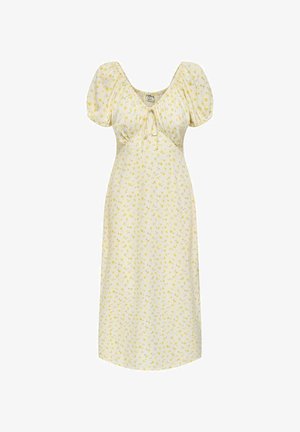 Crèmekleurige midi-jurk met pofmouwen, kleine gele bloemenprint, geplooide buste en een strikdetail bij de halslijn.