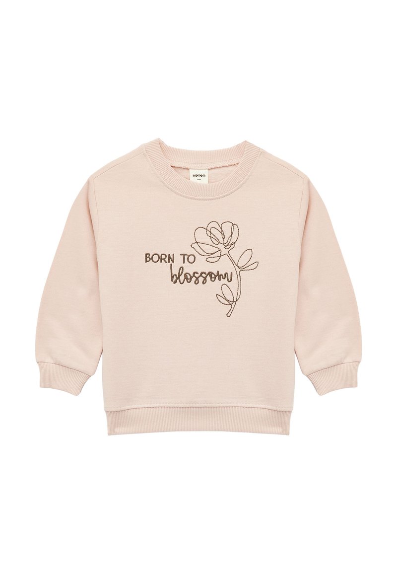 Lichtroze sweatshirt met geribbelde manchetten en halslijn. Bevat bruin geborduurde tekst "BORN TO" en een bloemontwerp. Zacht katoenmixmateriaal.