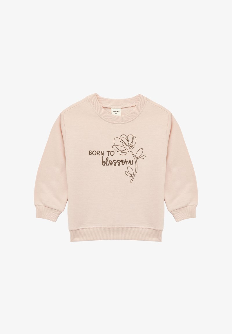 Lichtroze sweatshirt met geribbelde manchetten en halslijn. Bevat bruin geborduurde tekst "BORN TO" en een bloemontwerp. Zacht katoenmixmateriaal.