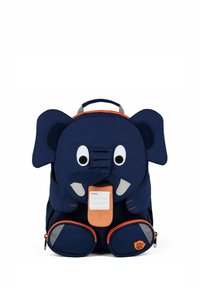 Children's backpack shaped like a navy blue elephant with large ears, eyes, trunk, and orange zipper details, including a name tag on the trunk.
