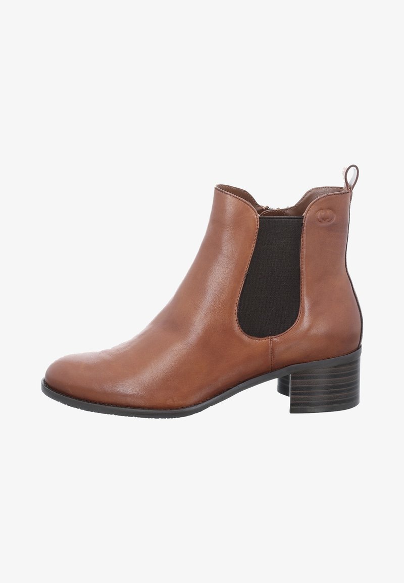 Bottine en cuir marron avec des panneaux élastiques sur les côtés, bout arrondi et talon bloc. Dispose d'une languette à l'arrière pour un enfilage facile.