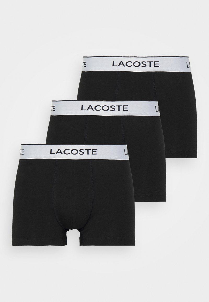 Black cotton boxer briefs with a white Lacoste logo waistband. Features a fitted design and a smooth texture. Pack of three.