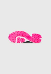 Shoe sole in bright pink with textured grip patterns and cleats, set against a plain light gray background.