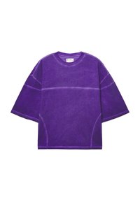 T-shirt viola oversize con maniche corte, realizzata in cotone, con una finitura testurizzata e dettagli di cucitura a contrasto.