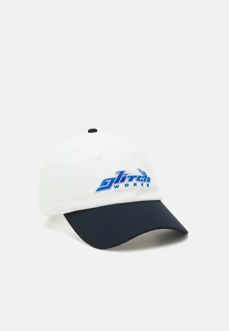 White cotton baseball cap with a navy visor, featuring a blue embroidered logo "Glitch Works" on the front.