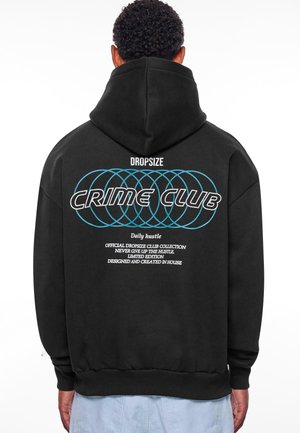 Black hoodie featuring a large "CRIME CLUB" graphic in bold text with turquoise accents. Includes additional white text details on the back.