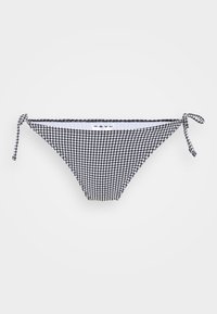 Melnbalts rūtainais bikini apakšdaļa ar sasienamām malām, kas izgatavota no mīksta auduma un piedāvā minimālu segumu. Uz etiķetes rakstīts "jūras zilais".