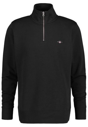 Black zippered sweatshirt with a high collar, made of soft fabric. Features ribbed cuffs and hem, with a small logo on the left chest.