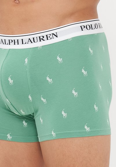 Zelene bokserice iz bombaža, z belim vzorcem polo igralca in belim pasom z logotipom "POLO RALPH LAUREN" v črni barvi.