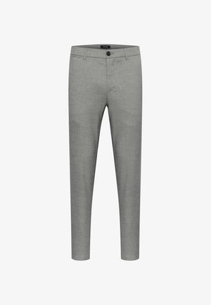 Pelēkas piegrieztas bikses ar gludu tekstūru, šaurs piegriezums, standarta jostasvieta, viena pogas aizdare un minimālistisks dizains.