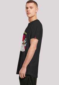 Black cotton t-shirt featuring a colorful graphic design with characters. Classic crew neck, short sleeves, and relaxed fit.