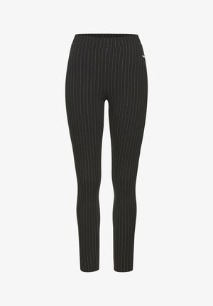 Zwarte leggings met verticale witte strepen, elastische tailleband, slim fit en een gladde textuur, geschikt voor casual of formele kleding.