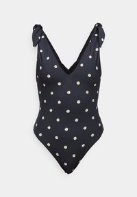 Fekete bikini kicsi fehér és sárga margaréta mintával, V nyakú designnal, állítható kötelekkel és sima szövettextúrával.