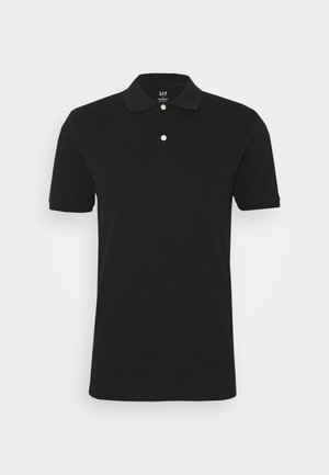 Black polo shirt made of cotton, featuring a flat collar, two-button placket, and short sleeves with subtle cuffs. No patterns or graphics.