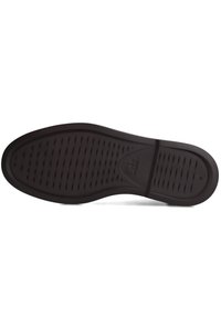 Zwarte schoenzool met horizontale groeven voor grip, gelabeld met maat 43 en een klein logo nabij het booggebied.