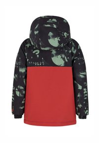 Veste réversible avec un motif graphique noir et vert et une partie inférieure rouge unie. Comprend une capuche et des poignets élastiques.
