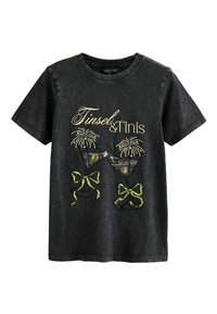 Black cotton T-shirt with round neckline, featuring gold and green embroidered text "Tinsel & Tinís" and cocktail glasses design with bows.