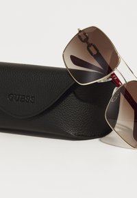 Guess Gafas de sol - gold-coloured/gradient brown