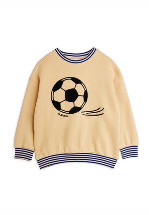 Sweat-shirt beige pour enfants avec col, poignets et ourlet rayés bleus et blancs, arborant un graphique de ballon de football noir et blanc.