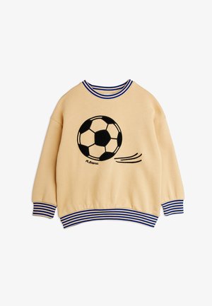 Sweat-shirt beige pour enfants avec col, poignets et ourlet rayés bleus et blancs, arborant un graphique de ballon de football noir et blanc.