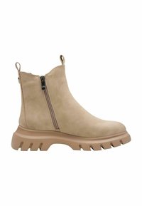 Botte chelsea beige en daim avec une fermeture éclair latérale, semelle en caoutchouc dotée de crampons épais, et une languette à l'arrière pour un enfilage facile.