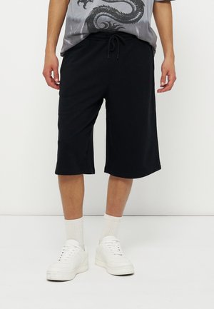YOURTURN UNISEX - Lühikesed püksid - black