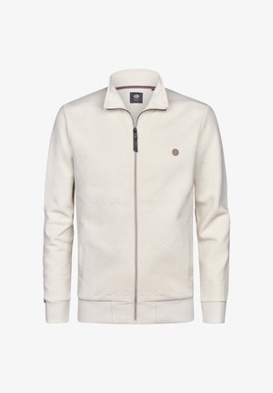 Herenjack met ritssluiting in lichtcrème. Gestructureerd patroon met diagonale lijnen, contrasterende donkere rits en logo-accent op de borst. Lange mouwen.