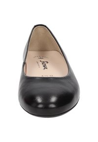 Black leather ballet flats with a rounded toe, smooth texture, and cushioned insole, labeled "SUPER SOFT" on the inner sole.