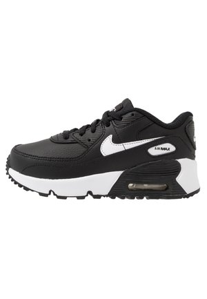 Mustavalkoinen Nike Air Max -lenkkari, jossa näkyvä ilmatiiviste, mustat kengännauhat ja valkoinen Nike Swoosh -logo sivussa.