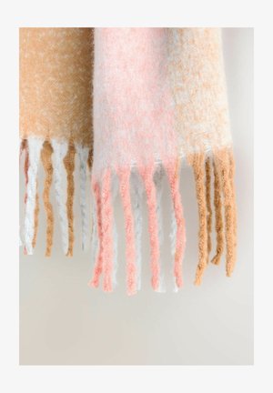 Woven scarf with a gradient of peach, white, and beige colors, featuring long fringes in alternating textures and soft, fuzzy material.