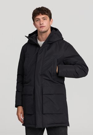 IMBOTTITO CON CAPPUCCIO E TASCONI - Cappotto invernale - nero