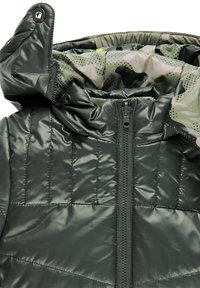 Dark green padded jacket with front zipper and hood lined with green and beige camouflage fabric.