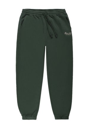 Zielone dresy z elastycznym paskiem w talii, z zamknięciem na sznurek, bocznymi kieszeniami i ribbownymi mankietami. Posiadają logo marki w białym tekście na biodrze.