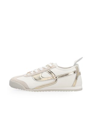White low-top sneaker with beige accents and metallic gold curved stripe, white laces, and pull tab at heel, displayed on a white background.
