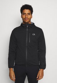 Calvin Klein Golf - ULTRON HOODED JACKET - Vízálló dzseki - black Miniatűr kép 1