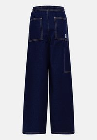 Dark blue denim wide-leg pants with elastic waistband, two back pockets, and contrasting stitching. Smooth texture and relaxed fit.