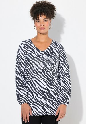 Langærmet top i sort og hvid zebra-print, med V-hals, samlet manchetter og en tekstureret design med en afslappet pasform.