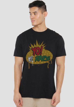 Black cotton t-shirt featuring a graphic design with the text "YO! RAPS" in red and green on a yellow burst background.