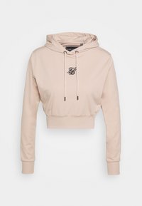 Beige Hoodie in Cropped-Form aus weichem Material, mit schwarzem gesticktem Logo auf der Brust, verstellbaren Kordeln und elastischen Bündchen.