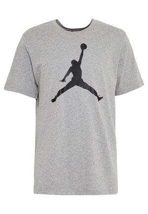 T-shirt in cotone grigio con maniche corte, caratterizzato da un grande logo silhouette nero di Jordan stampato al centro. Design classico con collo a giro.