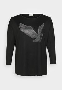 Schwarzes Langarmshirt mit einem glänzenden Adlerdesign aus silbernen Strasssteinen, entspannt geschnitten und mit rundem Ausschnitt.