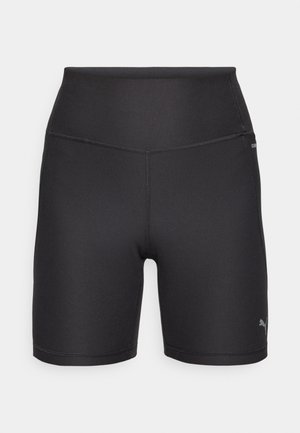 Sorte treningshorts laget av elastisk stoff. Høy livlinje, tett passform, med flate sømmer og en liten logo på siden.
