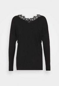 Pull noir à manches longues avec un col en V orné d'une délicate bordure en dentelle noire sur un fond uni.