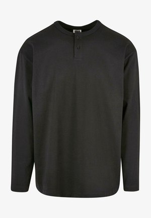 Fekete, hosszú ujjú henley póló, puha pamutból készült, kerek nyakkivágással és háromgombos kivágással. Sima textúra, egyenes szabás.